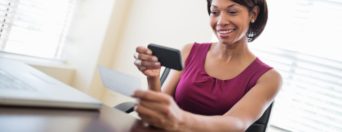 Woman taking picture with her cell phone.